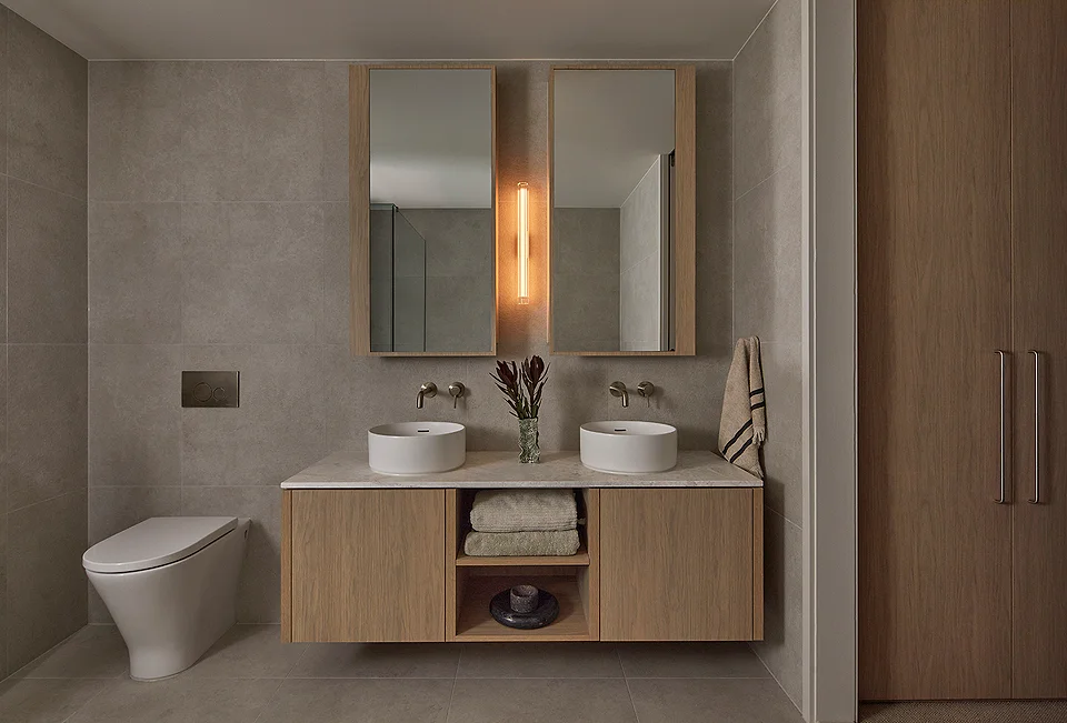Sandringham Residences - Ensuite bathroom with dual vessel sinks and timber vanity